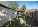 Side yard with detached garage and stone pathway at 4157 Perry St, Denver, CO 80212