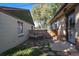 Small, private backyard with patio seating and wooden fence at 4157 Perry St, Denver, CO 80212