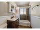 Bathroom features a shower/tub combo and dark vanity at 4157 Perry St, Denver, CO 80212