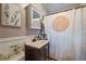 Bathroom with a shower/tub combo and updated vanity at 4157 Perry St, Denver, CO 80212