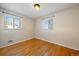 Bedroom features neutral-colored walls, hardwood floors, and a bright window at 4157 Perry St, Denver, CO 80212