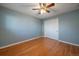 Simple bedroom with hardwood floors and light blue walls at 4157 Perry St, Denver, CO 80212