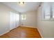 Bedroom with neutral walls, hardwood floors and a window at 4157 Perry St, Denver, CO 80212