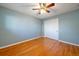 Bright bedroom with neutral walls, hardwood floors, a ceiling fan, and closet at 4157 Perry St, Denver, CO 80212