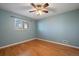 Bedroom with hardwood floors and a window with blinds at 4157 Perry St, Denver, CO 80212