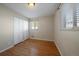 Bedroom with hardwood floors, double closets, and a window at 4157 Perry St, Denver, CO 80212