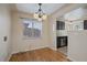 Bright dining area with hardwood floors and kitchen access at 4157 Perry St, Denver, CO 80212