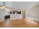 Dining area with hardwood floors and open view to the kitchen at 4157 Perry St, Denver, CO 80212