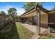 Brick ranch home with covered patio and a partially fenced backyard at 4157 Perry St, Denver, CO 80212