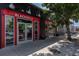 Blackbelly Market storefront featuring red trim and glass doors, showcasing the business's welcoming atmosphere and curb appeal at 4157 Perry St, Denver, CO 80212