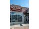 Post Oak Barbecue storefront featuring large windows and brick facade, showcasing the business's inviting ambiance at 4157 Perry St, Denver, CO 80212