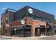 Exterior view highlighting the mixed-material facade, rooftop patio, and signage of this distinctive multi-story restaurant at 4157 Perry St, Denver, CO 80212