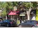 Shops along a treelined street featuring Gelato Boy and Jolly Goods with curb appeal at 4157 Perry St, Denver, CO 80212