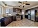 Well-equipped kitchen with granite countertops, stainless steel appliances, and tile floors at 4157 Perry St, Denver, CO 80212