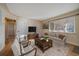 Bright living room with hardwood floors, comfy seating, and large windows at 4157 Perry St, Denver, CO 80212