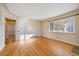 Bright living room featuring hardwood floors and a large window with natural light at 4157 Perry St, Denver, CO 80212