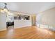 Open-concept living area connected to the kitchen, showcasing hardwood floors and natural light at 4157 Perry St, Denver, CO 80212