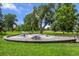 Park with circular picnic area and large shade tree at 4157 Perry St, Denver, CO 80212