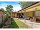 Relaxing covered patio with comfortable seating, perfect for outdoor entertaining and enjoying the backyard at 4157 Perry St, Denver, CO 80212