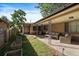 Covered patio with comfortable seating area, perfect for outdoor entertaining at 4157 Perry St, Denver, CO 80212