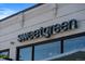 Exterior view of Sweetgreen, featuring its modern illuminated signage at 4157 Perry St, Denver, CO 80212