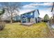 Expansive backyard featuring a multi-tiered wooden deck and well-maintained landscaping at 12842 Bellaire St, Thornton, CO 80241