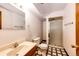Basement bathroom featuring a vanity and shower with black and white flooring at 12842 Bellaire St, Thornton, CO 80241