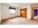 Bedroom featuring natural light, closet and trim accents at 12842 Bellaire St, Thornton, CO 80241