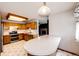 Cozy kitchen with an island, stainless steel appliances, and updated cabinets at 12842 Bellaire St, Thornton, CO 80241