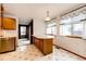 Bright kitchen featuring custom island, classic cabinets and eat in area with lots of natural light at 12842 Bellaire St, Thornton, CO 80241