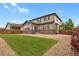 Backyard featuring a grass area and low maintenance gravel area at 30 S Ider Way, Aurora, CO 80018