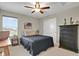 Bedroom featuring a large window for natural light, and neutral colored walls at 30 S Ider Way, Aurora, CO 80018
