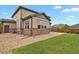 Exterior angle of home featuring manicured lawn and low maintenance gravel at 30 S Ider Way, Aurora, CO 80018