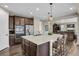 Spacious kitchen features granite counters, stainless appliances, and dark wood cabinets at 30 S Ider Way, Aurora, CO 80018