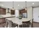 Well-appointed kitchen with granite countertops, stainless steel appliances, and a stylish kitchen island at 30 S Ider Way, Aurora, CO 80018