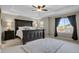 Main bedroom features a tray ceiling, ceiling fan, and large windows at 30 S Ider Way, Aurora, CO 80018