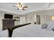 Main bedroom boasts a tray ceiling, ceiling fan, and neutral paint at 30 S Ider Way, Aurora, CO 80018
