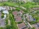 An aerial view highlights the community's layout with lush green spaces and well-maintained landscaping near a parking lot at 5836 S Vivian Way, Littleton, CO 80127