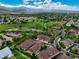 Scenic aerial view of neighborhood with mountain backdrop and community park at 5836 S Vivian Way, Littleton, CO 80127