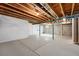 Spacious unfinished basement with open ceilings and concrete floor at 5836 S Vivian Way, Littleton, CO 80127