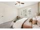 This bright bedroom features three large windows with shutters, and a plush carpet at 5836 S Vivian Way, Littleton, CO 80127