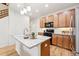 Modern kitchen with granite counters, stainless appliances and wood cabinets create a functional and stylish space at 5836 S Vivian Way, Littleton, CO 80127