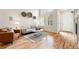 Bright living room with hardwood floors, large windows, and stylish decor at 5836 S Vivian Way, Littleton, CO 80127