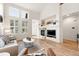 Comfortable living area with a fireplace, plenty of natural light, and modern touches at 5836 S Vivian Way, Littleton, CO 80127