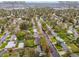 Aerial view of the property near Centennial Park, King Soopers, and surrounding neighborhood at 3379 W Wagon Trail Dr, Englewood, CO 80110