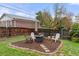 Well-maintained backyard with a cozy seating area with chairs around a firepit at 3379 W Wagon Trail Dr, Englewood, CO 80110
