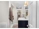 Bathroom with sleek vanity, gold mirror, and shower, offering a blend of style and functionality at 3379 W Wagon Trail Dr, Englewood, CO 80110