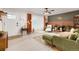 Cozy living room features a large window, stylish decor, ceiling fan, and comfortable seating for relaxation and enjoyment at 3379 W Wagon Trail Dr, Englewood, CO 80110