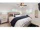 Bright bedroom with large windows, ceiling fan, and stylish decor at 3379 W Wagon Trail Dr, Englewood, CO 80110