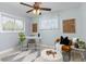 Cozy office space with modern desk, chair, ottoman, and contemporary decor at 3379 W Wagon Trail Dr, Englewood, CO 80110